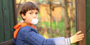 little boy blowing bubble