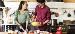 couple cooking together in the kitchen
