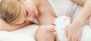 woman breastfeeding a baby